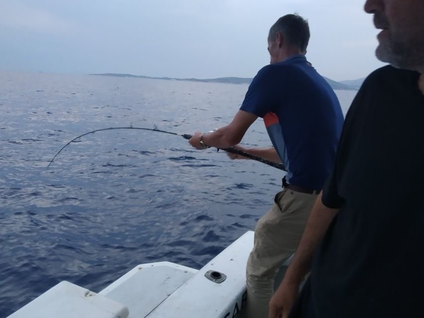 Athens: Fishing Trip Experience on a Boat with Seafood Meal - Swim breaks and crew-friendly downtime on a small boat day