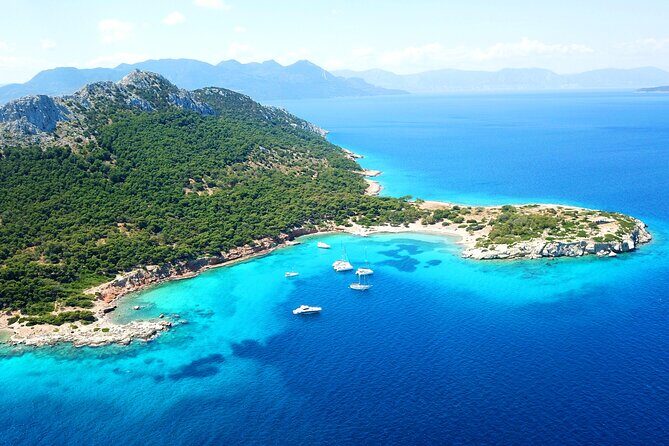 Athens: Full-Day Island Hopping Cruise with Lunch and Swimming - Agistri island: pine hills, cliffs, and swimming that doesn’t require beach chairs