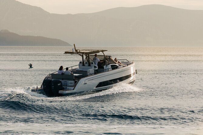 Athens Riviera Private Sunset Boat Cruise - Stop 1: Vouliagmeni Beach swim time with Blue-Flag vibes