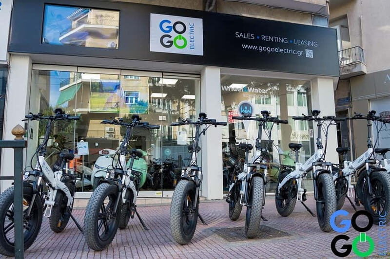 E-Bike Tour of the Historical Center of Athens - Plaka: old buildings, balcony flowers, and a local market break
