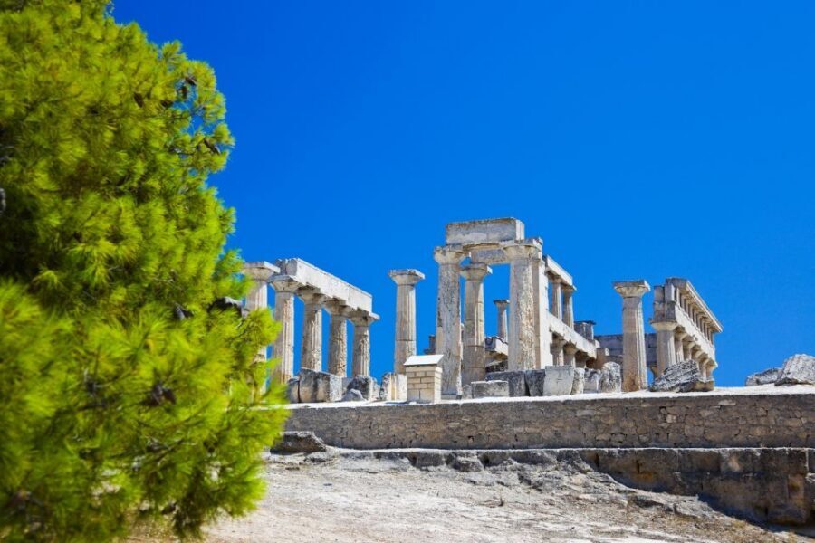 From Athens: Saronic Islands Full-Day Cruise with VIP Seats - Poros in about 50 minutes: pines, white lanes, and a clock tower moment