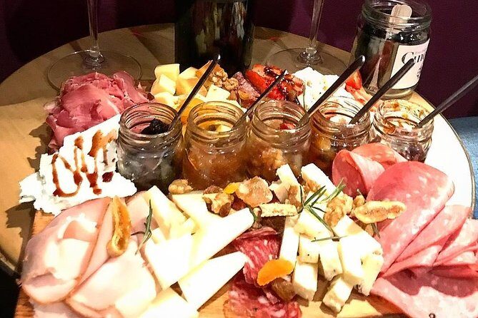 Greek food and wine tasting - The food spread: PDO cheese, charcuterie, olives, vegan options, and pita