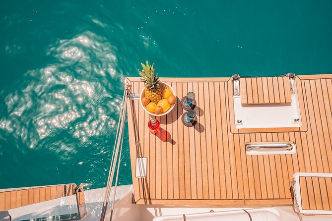 Luxury Catamaran Sunset Semi-Private & Greek Gastronomy in Athens - Vouliagmeni Beach is the bonus stop, not the guarantee