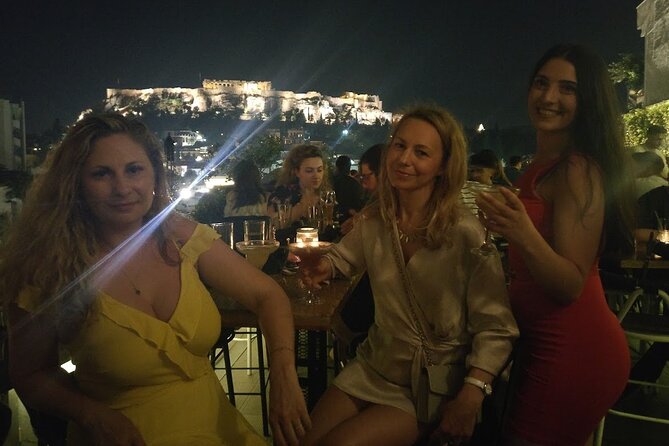 Rooftop Bar Hopping with Local Friends - Stop one: the first rooftop, local Greek wine, and the warm-up mood