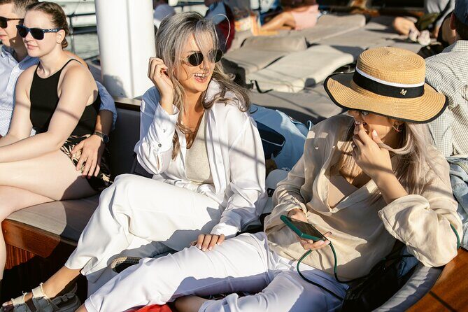 Sunset Dinner Cruise: Sunset, Swim, Drinks, and Dinner Onboard - Vouliagmeni swim stop: a second, flexible water break